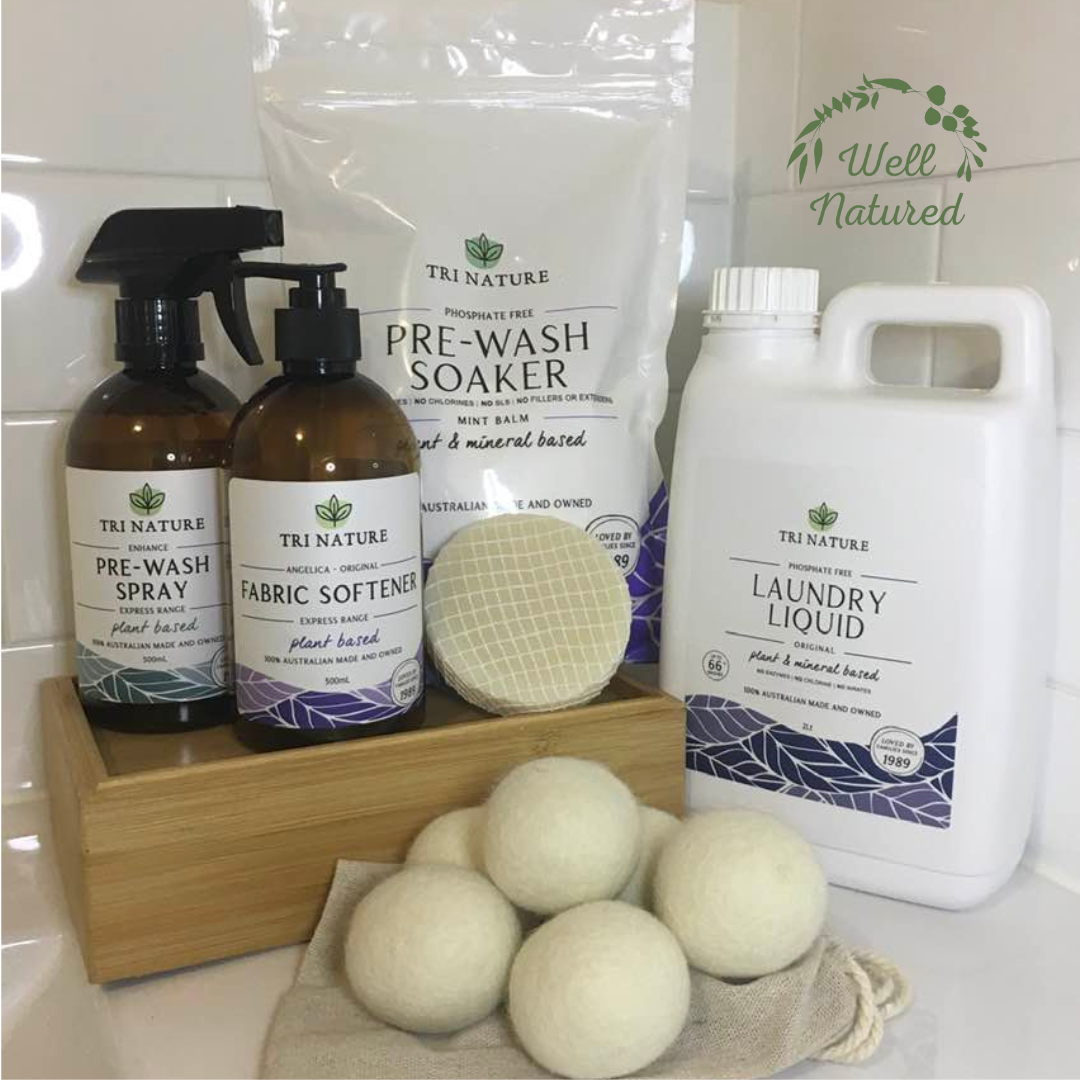A group photo of 6 laundry products such as laundry liquid, pre wash soaker powder, fabric softener, pre wash spray and wool dryer balls.