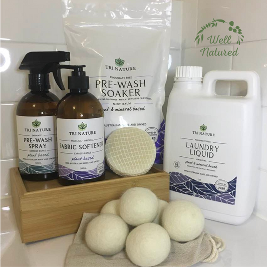 A group photo of 6 laundry products such as laundry liquid, pre wash soaker powder, fabric softener, pre wash spray and wool dryer balls.